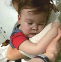  ?? AP ?? Brain-damaged toddler Alfie Evans cuddles his mother Kate James at Alder Hey Hospital, Liverpool, England on April 23, 2018. —