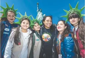  ?? KELLY MARSH/GIRL SCOUTS OF GREATER NEW YORK VIA AP ?? Girl Scouts Troop 6000 visits the Statue of Liberty in New York in 2023. Troop 6000 has served children who live in New York’s shelter system since 2017.