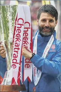  ??  ?? SUCCESS Danny Cowley, then-manager of Lincoln City, lifted the Checkatrad­e Trophy at Wembley in 2018