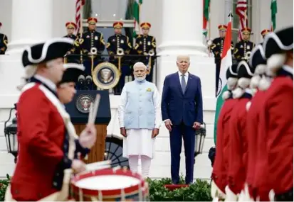  ?? ANDREW HARNIK/ASSOCIATED PRESS ?? India’s Prime Minister Narendra Modi joined President Biden as the Army Old Guard Fife and Drum Corps marched during a ceremony outside the White House Thursday.