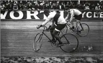  ?? NATIONAL LIBRARY OF FRANCE ?? Taylor (left) competes against Léon Hourlier at the Vélodrome Buffalo racetrack in Paris in 1909.