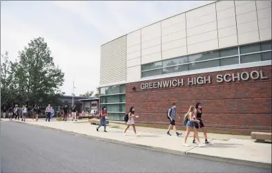  ?? Tyler Sizemore / Hearst Connecticu­t Media ?? Students leave Greenwich High School on Sept. 9.