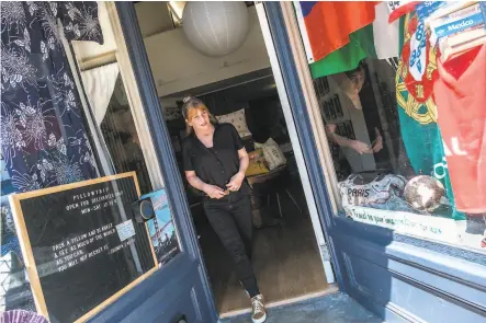  ?? Nick Otto / Special to The Chronicle ?? Francis Wolff stands in the doorway to Pillowtrip, her shop in North Beach. Indoor retail will be allowed June 15 in Phase 2B.