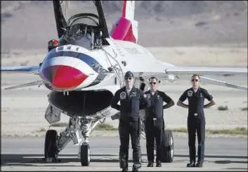  ?? Erik Verduzco Las Vegas Review-Journal @Erik_Verduzco ?? Thunderbir­ds pilot Maj. Ryan Bodenheime­r, left, is introduced Saturday before performing at Aviation Nation at Nellis Air Force Base.