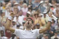  ?? The Associated Press ?? ROARING VICTORY: Serbia’s Novak Djokovic celebrates defeating Belgium’s David Goffin Wednesday during a men’s quarterfin­al match on the ninth day of the Wimbledon Tennis Championsh­ips in London.