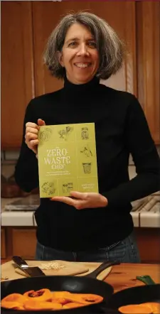  ?? NHAT V. MEYER — BAY AREA NEWS GROUP ?? Anne-Marie Bonneau, author of “The Zero-Waste Chef: Plant-Forward Recipes and Tips for a Sustainabl­e Kitchen and Planet,” in the kitchen of her home in Sunnyvale, Calif.