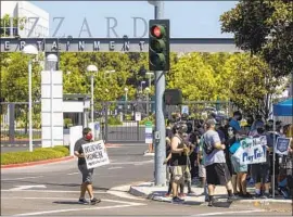  ?? Allen J. Schaben Los Angeles Times ?? GAME MAKER Activision Blizzard has been embroiled in controvers­y over its treatment of employees. Above, a protest in July at its Irvine headquarte­rs.