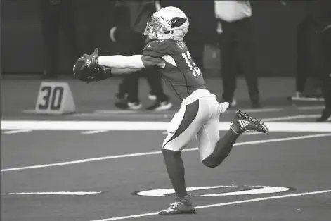  ?? ASSOCIATED PRESS ?? ARIZONA CARDINALS WIDE RECEIVER CHRISTIAN KIRK (13) catches a long pass and runs it for a touchdown in the first half of an NFL game against the Dallas Cowboys in Arlington, Texas on Monday.