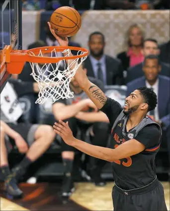  ?? Jonathan Bachman/Getty Images ?? New Orleans Pelicans forward Anthony Davis goes up for a shot in the first half of the NBA All-Star Game Sunday at Smoothie King Center in New Orleans.