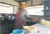  ?? ?? HOME COOKING. Betty Nkambule in her kitchen next to a constructi­on site.