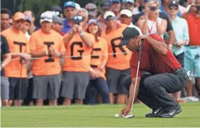  ?? JASEN VINLOVE/USA TODAY SPORTS ?? Tiger Woods lines up a putt during the final round of the Valspar Championsh­ip, where he finished tied for second place.