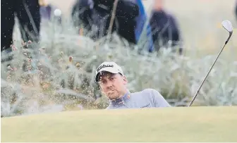  ??  ?? Leading British player Ian Poulter plays out of a bunker at Royal Birkdale