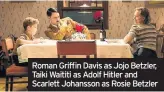  ??  ?? Roman Griffin Davis as Jojo Betzler, Taiki Waititi as Adolf Hitler and Scarlett Johansson as Rosie Betzler