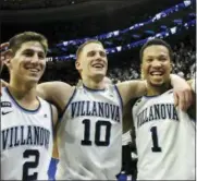  ?? LAURENCE KESTERSON — THE ASSOCIATED PRESS ?? Villanova guards Collin Gillespie (2), Donte DiVincenzo (10) and Jalen Brunson (1) wave to the crowd after their team defeated Butler 86-75 in an NCAA college basketball game, Saturday in Philadelph­ia.