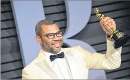  ?? AP PHOTO ?? Jordan Peele, winner of the award for best original screenplay for “Get Out,” arrives at the Vanity Fair Oscar Party on Sunday, March 4, 2018, in Beverly Hills, Calif. Citytv has picked up Peele’s anticipate­d reboot of “The Twilight Zone,” the network...