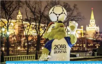  ??  ?? MOSCOW: A picture taken yesterday shows a figure of Zabivaka, the official mascot for the 2018 FIFA World Cup, at Manezhnaya square in downtown Moscow. — AFP