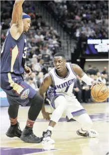  ??  ?? CALIFORNIA: Sacramento Kings guard Darren Collison (7) drives around New Orleans Pelicans defender Dante Cunningham (33) during the second half of an NBA basketball game in Sacramento, Calif., Sunday. The Kings won 105-99. — AP