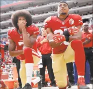  ?? Marcio Jose Sanchez / Associated Press ?? San Francisco 49ers quarterbac­k Colin Kaepernick, left, and safety Eric Reid kneel during the national anthem before an NFL football game in 2016.