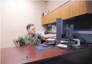  ?? GREGORY BULL/ASSOCIATED PRESS ?? Marine Chief Warrant Officer David Coan, 35, works at his desk in Camp Pendleton, Calif., on May 16. Coan has applied to be a part of a new cyber force.