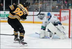  ?? MICHAEL DWYER - THE ASSOCIATED PRESS ?? Vancouver Canucks’ Jacob Markstrom blocks a shot by Boston Bruins’ David Pastrnak (88) during the second period of an NHL hockey game in Boston, Tuesday, Feb. 4, 2020.