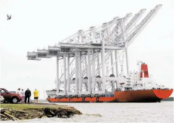  ?? Melissa Phillip / Houston Chronicle ?? A ship on Tuesday transports four Super Post-Panamax wharf cranes to the Port of Houston.