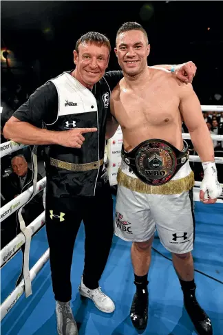  ?? PHOTOSPORT ?? Kevin Barry and Joseph Parker celebrate after Parker beat Alaxander Dimitrenko earlier this month.