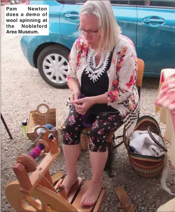  ??  ?? Pam Newton does a demo of wool spinning at the Nobleford Area Museum.