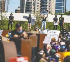  ?? AZIN GHAFFARI ?? Thousands of people gathered in Poppy Plaza to protest against racism and police brutality on June 3. City council’s community and protective services committee is starting a public hearing on systemic racism Tuesday.