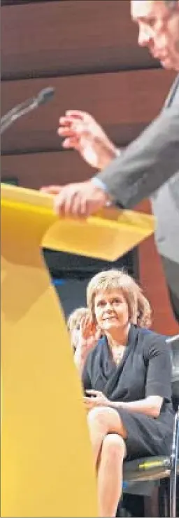  ??  ?? Nicola Sturgeon watches Alex Salmond speak at the SNP