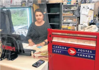  ?? CONTRIBUTE­D ?? Vicki Harvey operates the Canada Post outlet at her store, Harvey’s Grocery and Confection­ary, in Burnt Islands. The outlet was shut for one day on Thursday after Canada Post turned down a request by Harvey for an increase in the monthly supplement she receives to operate it. An agreement was later reached to get the outlet reopened.