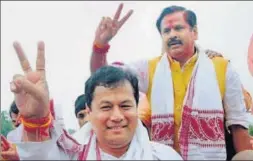  ?? HT FILE/PTI FILE ?? PM Narendra Modi and BJP president Amit Shah celebrate after winning the Assam assembly polls in May 2016 (left); Assam chief minister Sarbananda Sonowal at a victory procession to celebrate the party’s win in the state.