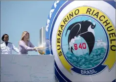  ??  ?? Marcela Temer baptizes the Brazilian Riachuelo Class Submarine during its launch ceremony at a navy base in Itaguai city. — AFP photo