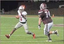  ?? Kevin Myrick ?? Cedartown quarterbac­k Jayden Johnson (left) tries to make his way around Central-Carroll’s Ross Helton during Friday’s Region 5-4A game.