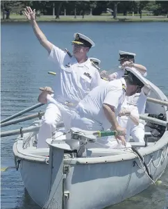  ?? ADRIAN WYLD / THE CANADIAN PRESS FILES ?? Vice-Admiral Mark Norman waves goodbye as he is traditiona­lly rowed away after stepping down as the head of the Royal Canadian Navy in June 2016.