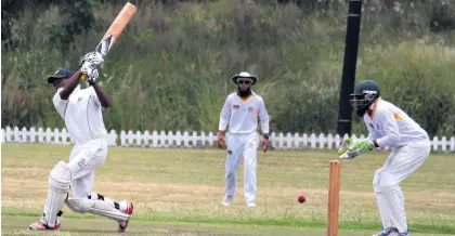  ??  ?? King Cetshwayo’s Bruce Tembo is about to hear the sound of falling timber as he tries to smash the rst ball he faces Dave Savides