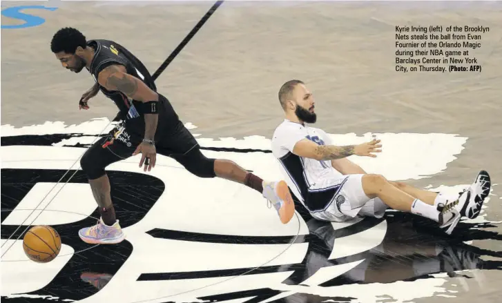  ?? (Photo: AFP) ?? Kyrie Irving (left) of the Brooklyn Nets steals the ball from Evan Fournier of the Orlando Magic during their NBA game at Barclays Center in New York City, on Thursday.