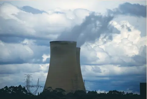  ?? (David Gray/Reuters) ?? STORM CLOUDS can be seen above the Bayswater coal-powered thermal-power station near Muswellbro­ok, Australia, last month. Stuart Palmer, head of ethics research at Australian Ethical Investment, said there is a danger that some marketing department­s...