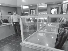  ?? [PAM OLSON FOR THE OKLAHOMAN] ?? Kenneth Corn, city manager of Anadarko, shows the cubicles he constructe­d for the conference tables used in city council meetings at City Hall in Anadarko.