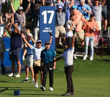  ?? Sam Greenwood/Getty Images ?? A ONE TO REMEMBER Aaron Rai raises his arm in triumph Saturday after hitting a hole-in-one on No. 17 at TPC Sawgrass — the fabled water hole — in the third round of The Players Championsh­ip in Ponte Vedra Beach, Fla.