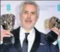  ?? AP ?? Alfonso Cuaron with Best Film and Best Director awards.