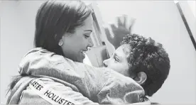  ?? LUANA MAZON THE ASSOCIATED PRESS ?? In this June 26 photo provided by paralegal Luana Mazon, Lidia Karine Souza, 27, hugs her nine-year-old son Diogo De Olivera Filho as Souza visited her son for the first time since they were separated at the U.S.-Mexico border in late May.