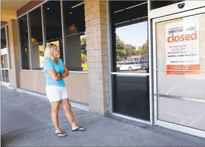  ?? STAFF FILE PHOTO ?? Deirdre Wyness stands in front of the empty storefront vacated by Nob Hill Foods on Santa Teresa Blvd. in San Jose on July 21. Neighbors like Wyness are concerned that the vacant storefront has now become the target of blight, trash, rats and crime...
