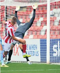  ??  ?? Luke Varney scores Cheltenham’s first equaliser