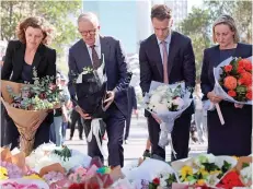 ?? AFP PHOTO ?? PAYING RESPECTS
(From left) Australian federal lawmaker Allegra Spencer, Prime Minister Anthony Albanese, New South Wales Premier Chris Minns and an unidentifi­ed woman are about to lay flowers at a makeshift memorial outside the Westfield Bondi Junction shopping mall in the eastern city of Sydney on Sunday, April 14, 2024.