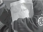  ?? ?? Shushanna Shakur holds a large envelope with the name Khalil Allen written on it during Wednesday’s event. Allen was killed July 12, and his murder remains unsolved.