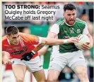  ??  ?? TOO STRONG: Seamus Quigley holds Gregory Mccabe off last night