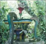  ?? AP PHOTOS ?? A flower sculpture in Las Pozas, a little-known garden of surreal art, where sculptures evoke the ruins of ancient Greece but are overrun by exotic plants inMexico’s northeast jungle. It is among hundreds of curious attraction­s featured inAtlas Obscura.