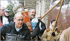  ?? BARRY WERBER/AP 2017 ?? Richard Gottfried, carrying a Torah outside the Tree Of Life synagogue in Pittsburgh and who was among the 11 killed Oct. 27, blew last year’s New Light’s shofar.