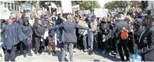  ?? Picture: SUE MACLENNAN ?? CALL TO ACTION: Students gather at the edge of the Rhodes University campus ahead of a march with Makhanda residents to protest against ongoing water outages in the town