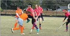  ?? 01_B40hockey0­6 ?? Playing in mid field Anne Watts leaps into the air to avoid a collision with an opposition player.